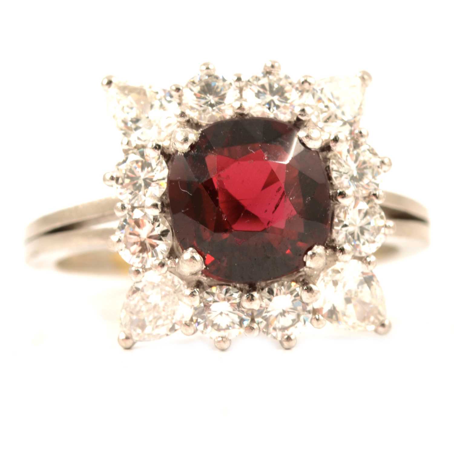 An almandine garnet and diamond cluster ring.