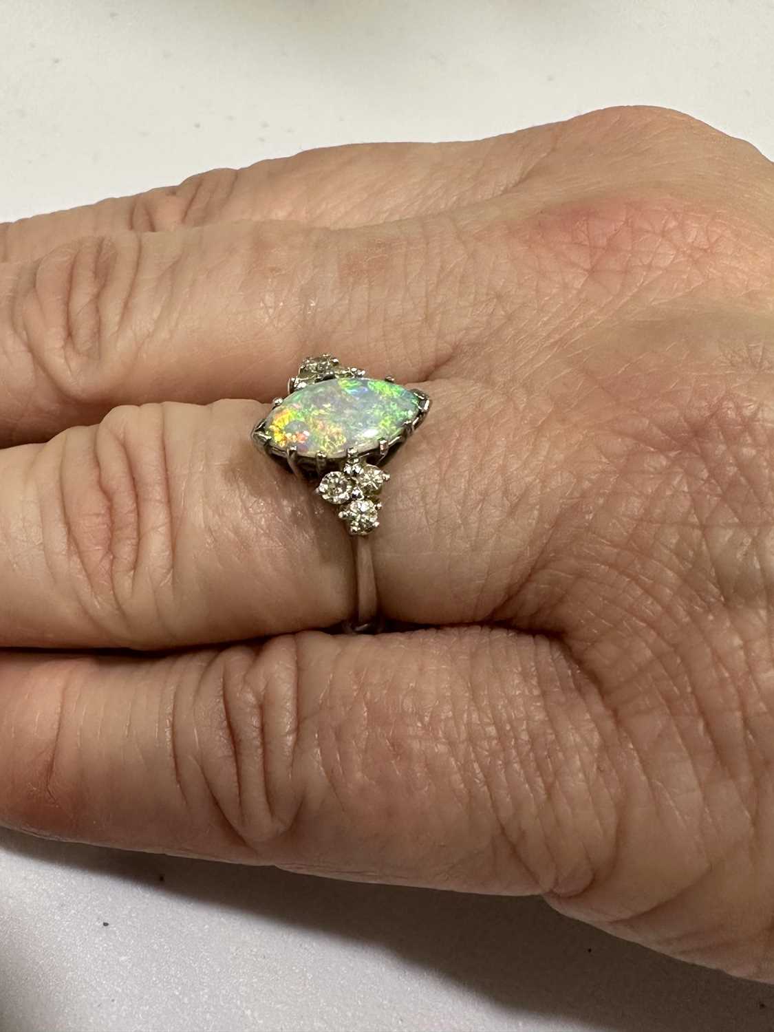 A marquise opal and diamond ring. - Image 4 of 5