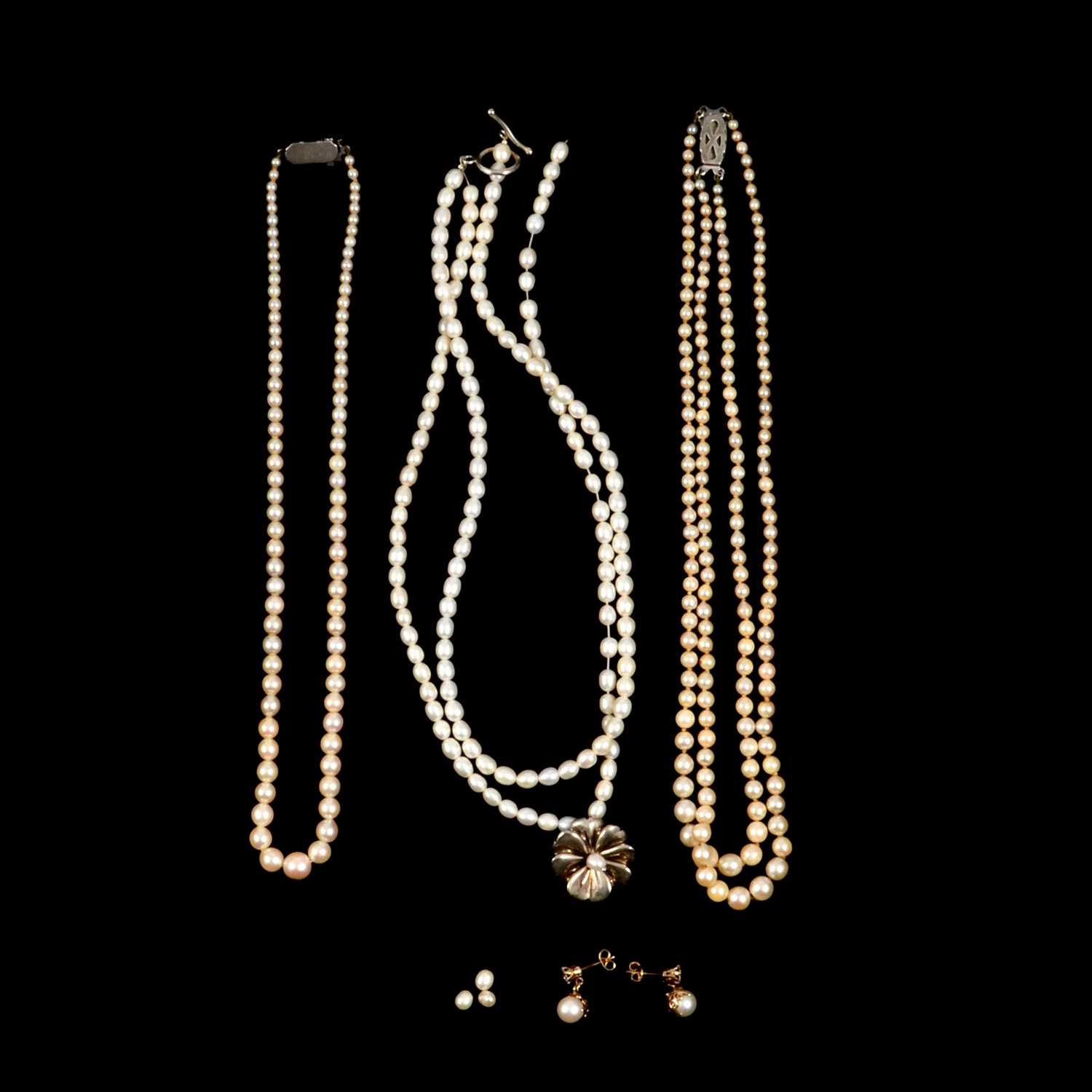 Three cultured pearl necklaces, pair of pearl earrings.