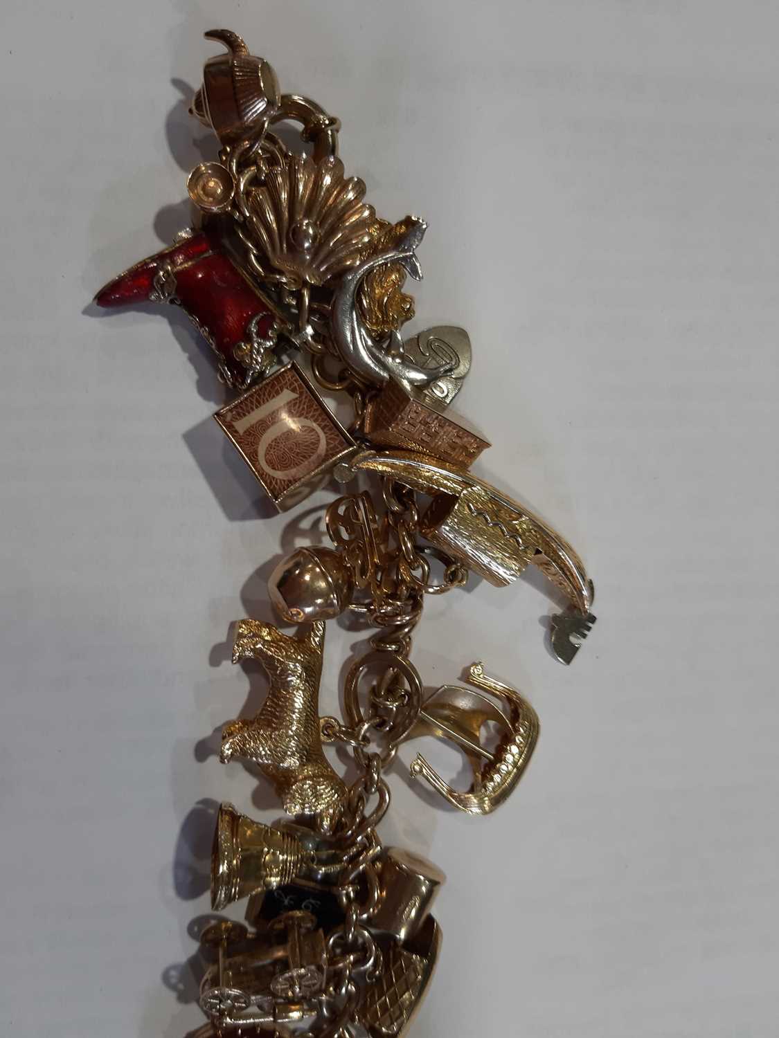 Two 9 carat yellow gold charm bracelets with charms of mixed metals and standards. - Image 3 of 7