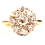 A diamond cluster ring.