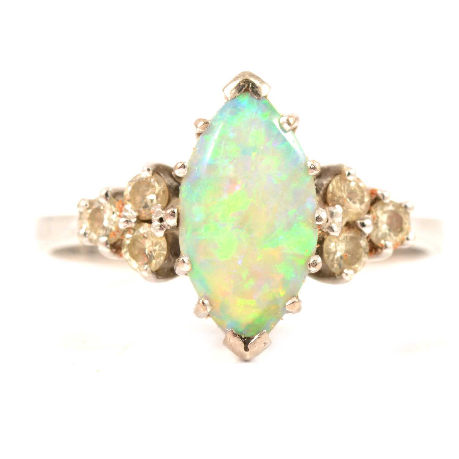 A marquise opal and diamond ring.