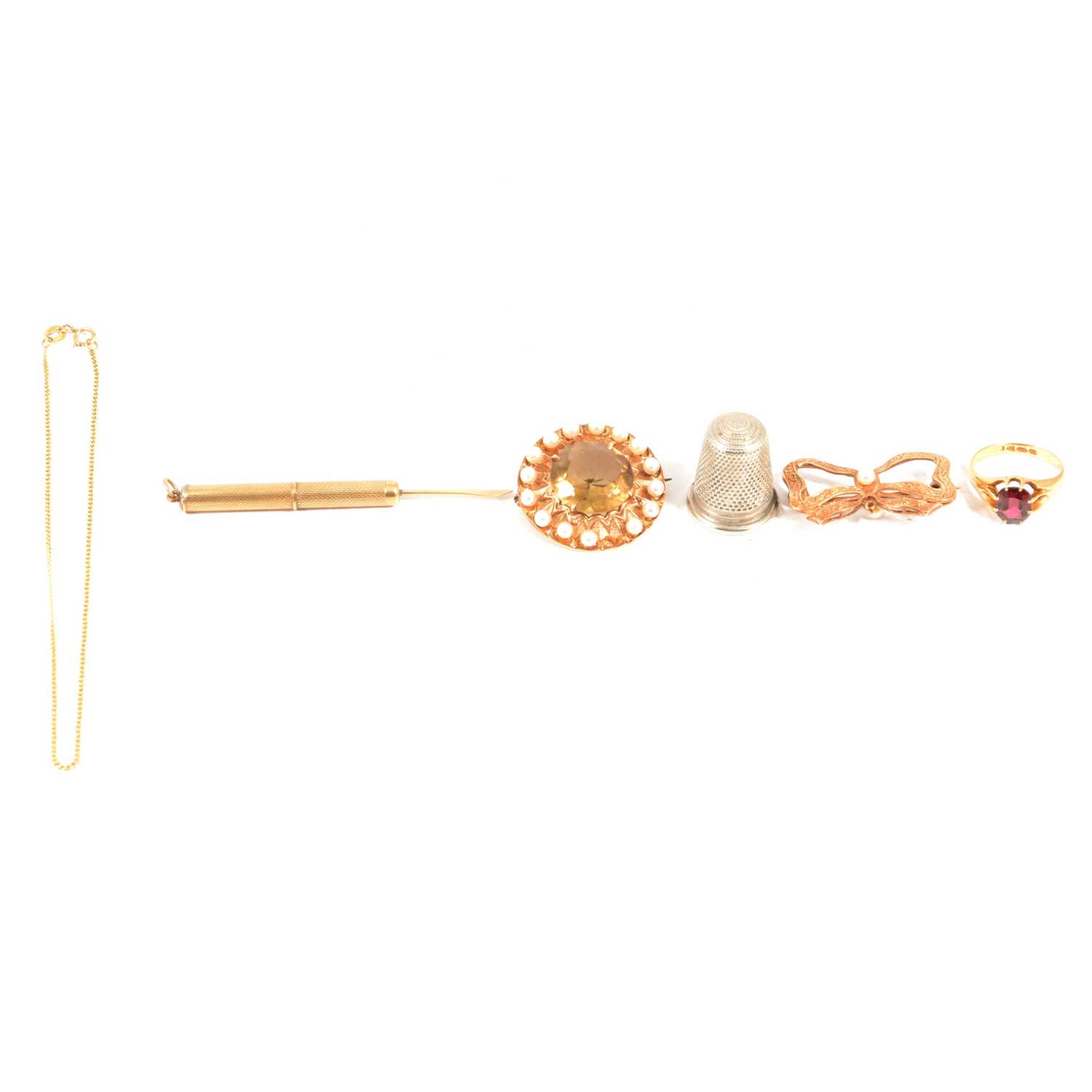 A gold ring, two brooches, toothpick, anklet.