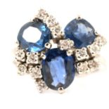 A contemporary sapphire and diamond cluster ring.