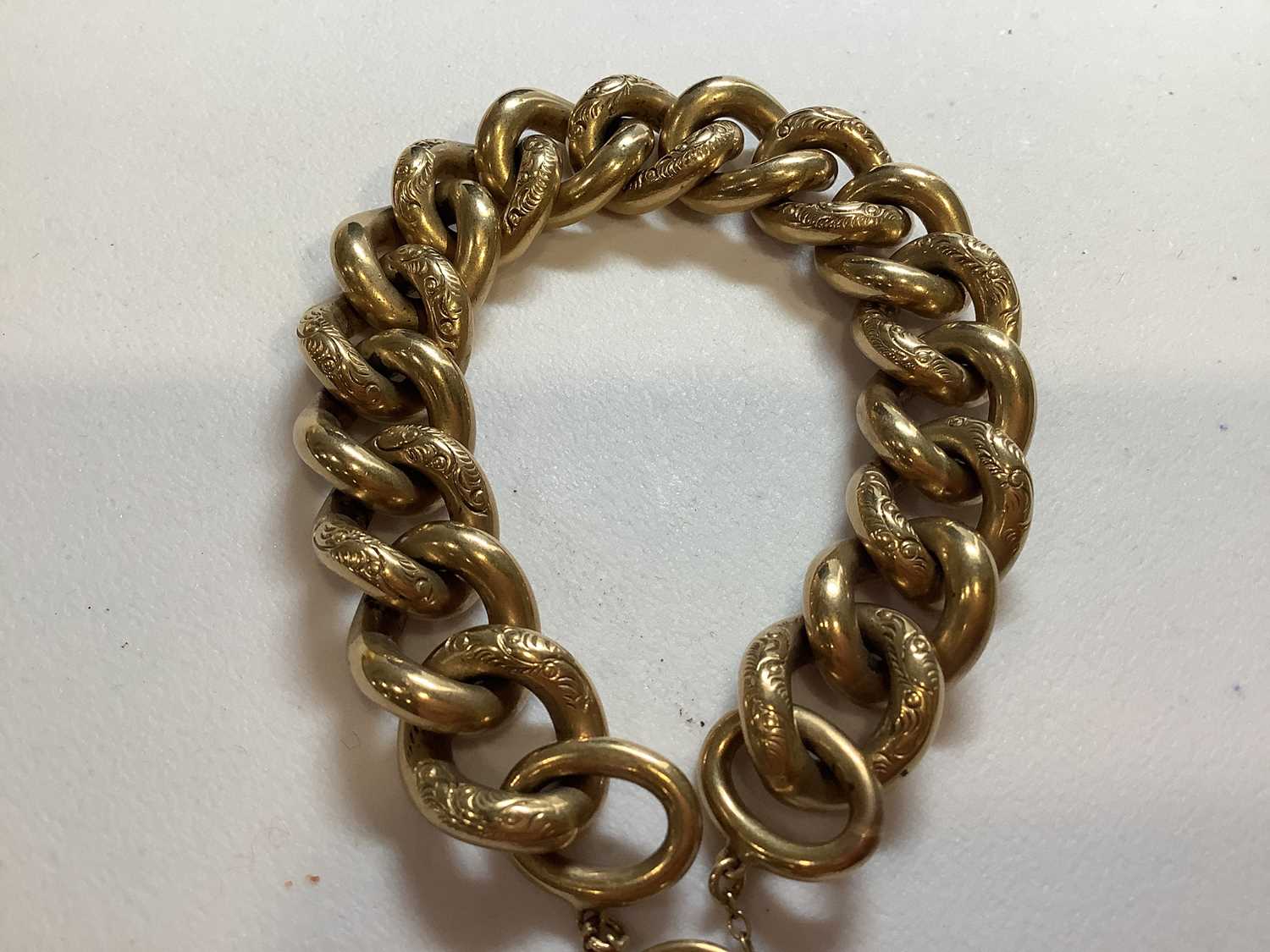 A 9 carat yellow gold solid curb link bracelet. - Image 2 of 8