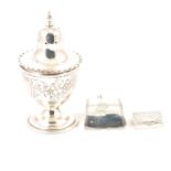 A silver vinaigrette, George III caddy spoon and pepperette.