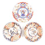 Pair of Imari plates and another similar