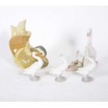 Lladro Mandarin Duck bookend, three Lladro geese, and another Spanish porcelain group of geese
