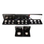 Five Royal Mint commemorative coin sets