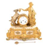 A 19th century gilt spelter and onyx figural mantel clock