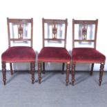 Set of four walnut dining chairs, a carver chair, and an inlaid music cabinet