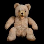 Vintage teddy bear, glass eyes, open mouth, bent legs, 24cm.