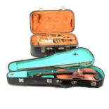 Three student Violins and a Cornet by Corton, all with cases.