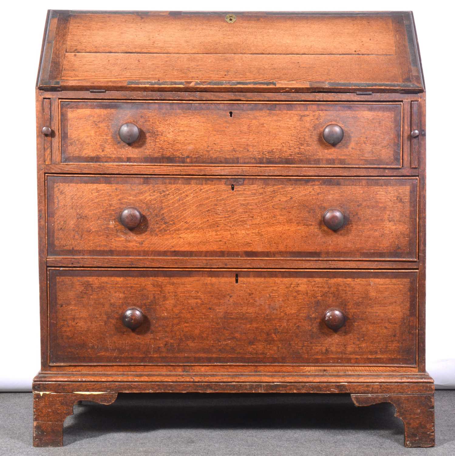 George III oak and mahogany banded bureau,