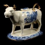 Staffordshire Cow Creamer with Willow pattern transfer, 19th century