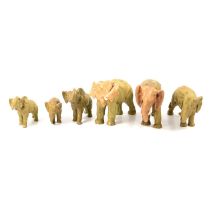 Pair of Sitzendorf porcelain figures, and set of six Royal Dux style elephants.