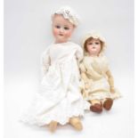 Schoenau & Hoffmeister bisque head doll, 1909 head stamp and one other.