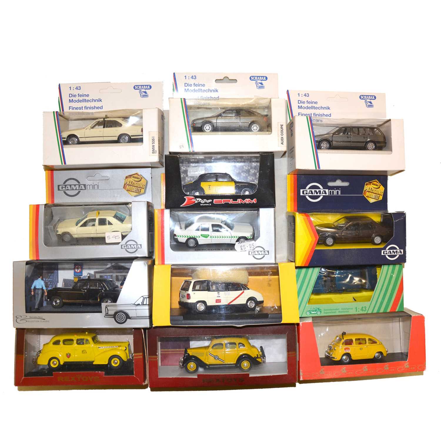 Thirteen die-cast model vehicles, including Rextoys, Schabak and others, boxed.