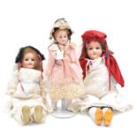 Three German bisque head dolls, including Simon and Halbig.