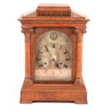 Late Victorian oak mantel clock, slate clock and two others,