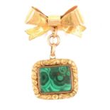 A malachite fob with locket back on a modern 9 carat gold bow.