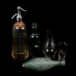 A quantity of vintage glassware, eye baths, measures, C Cooke of Kettering bottles and Soda Water sy