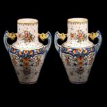 A pair of twin-handled faience pottery vases