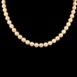 A cultured pearl necklace with sapphire clasp.