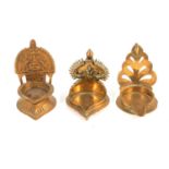 Three Asian brass spirit lamps,