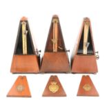 Three late 10th/ early 20th century Maelzel metronomes,