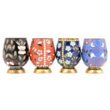 Set of fur Russian silver gilt and enamelled small tumblers,
