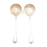 Pair of mid-19th century French white metal sifting spoons.