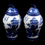 A pair of Copeland Spode Willow Tree pattern blue and white covered vases