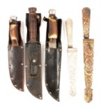 Three Bowie knifes, one stamped Sheffield Black Eagle; and two Argentina knifes.