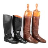 Two pairs of leather riding boots and one pair of wooden boot trees,