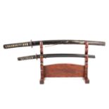 Two Japanese swords and a sword stand,