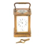 A carriage style repeating clock striking on the hour and half hour with alarm.