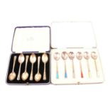 Set of six silver and enamelled coffee spoons, and six silver teaspoons, cased.