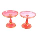 Pair of Victorian cranberry glass tazza, gilt.