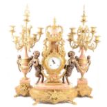 An Italian brass and marble reproduction three piece clock garniture.