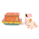Vintage Noah's Ark toffee tin and a crawling baby doll.