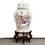 Very large modern Chinese polychrome covered vase, on wooden stand