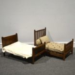 Two dolls beds, one Edwardian with striped ticking fabric