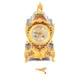 A Mappin & Webb Boulle style twin train mantel clock.