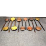 Quantity of eleven copper and brass warming pans