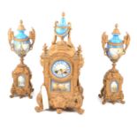 Louis XVI style gilt metal and Bleu de Roi Sevres style porcelain three-piece mantel clock