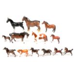 Thirteen Beswick horses.