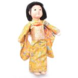 Japanese composition doll, c1930s with outfit, length 40cm.