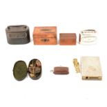 Brass sovereign scales, sovereign purse, apothecary scales and five money boxes.