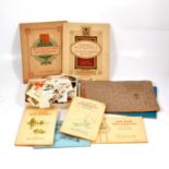 Two boxes of cigarette cards, some in albums.